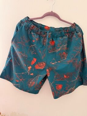 The North Face Teal Shorts with Orange Abstract Print